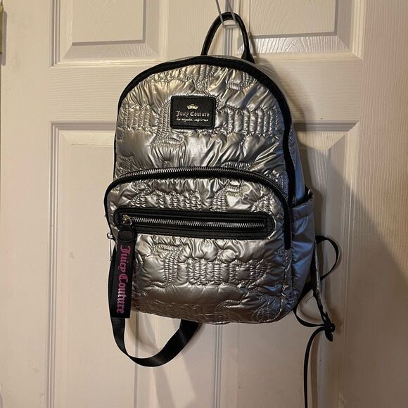 Juicy Couture Handbags - Juicy Couture Metallic quilted silver Backpack with black trim.